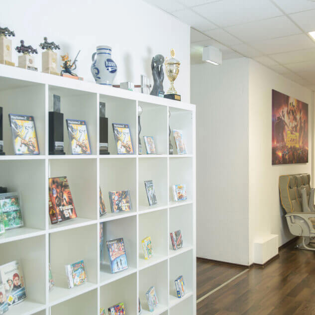 Shelf with various Keen books and game merchandise