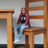 Keen employee sitting on a very large chair