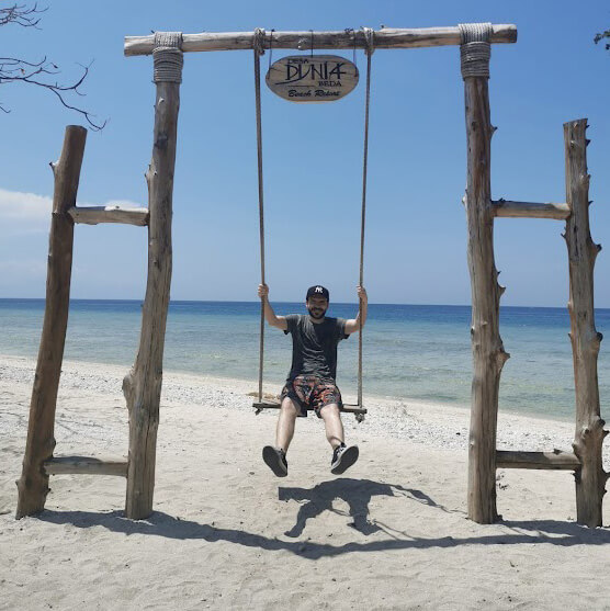 Keen employee on a swing made of wood